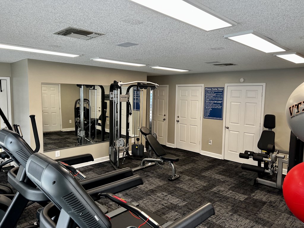 a room filled with lots of exercise equipment