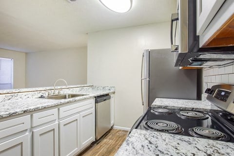 the preserve at ballantyne commons apartment kitchen with granite counter tops and stainless appliances