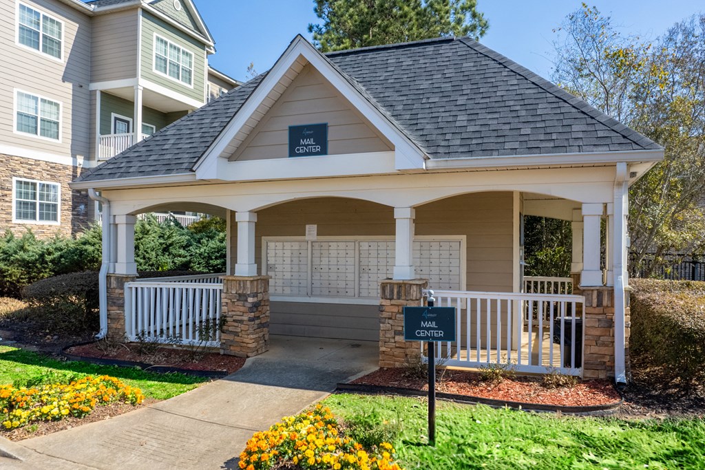 a small porch with a sign in front of a house