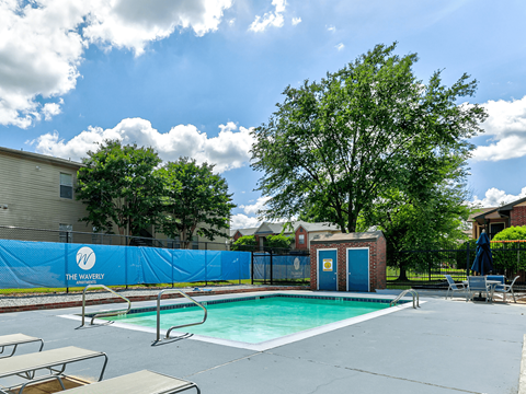 our apartments have a swimming pool and a blue privacy fence