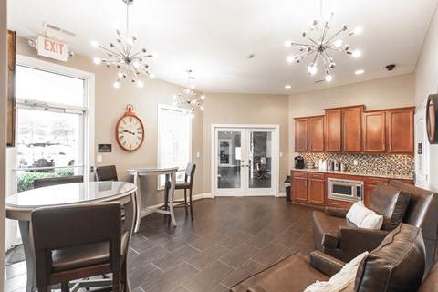 A living room with a dining table and chairs.