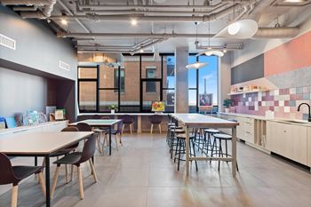 a craft room with tables and chairs