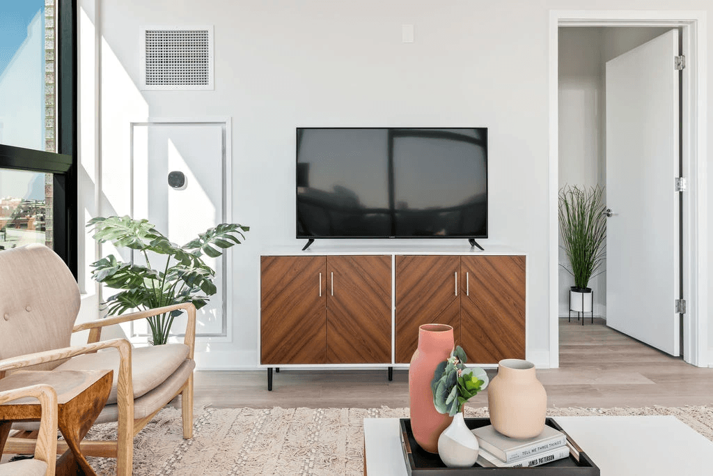 a living room with a tv on the wall