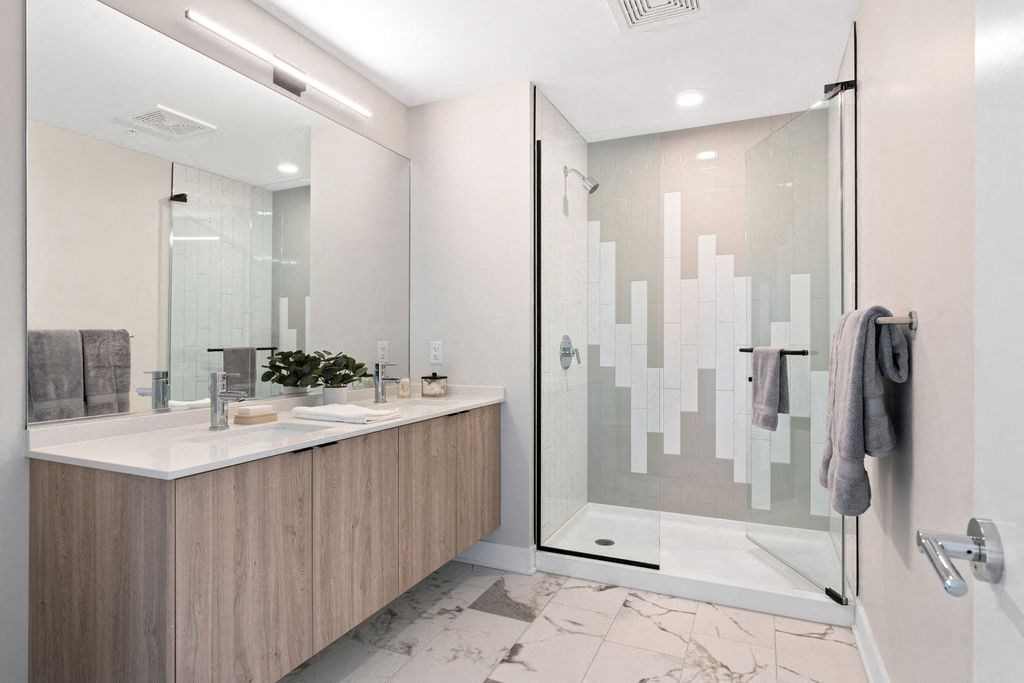 Double vanity bathroom with shower