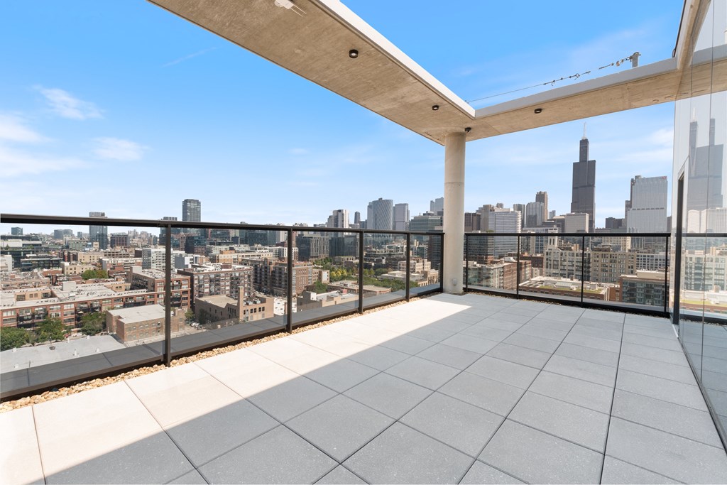 a view of the chicago skyline from a balcony