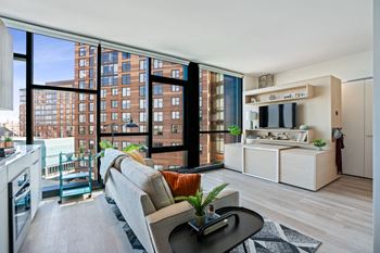a living room with a couch and a large window