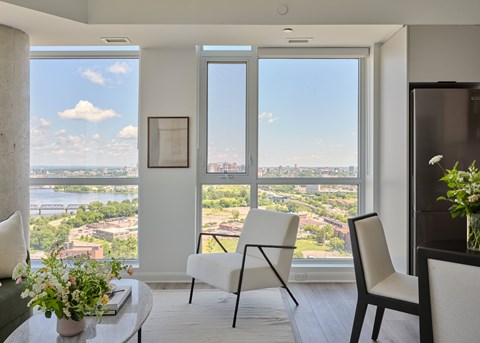 A living room with a view of the cityscape.