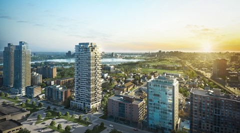 an aerial view of a city with tall buildings and a river