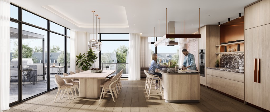 A modern kitchen with a dining table and chairs.