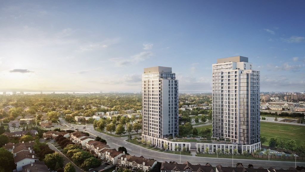 Two modern high-rise buildings are situated in a green, tree-filled urban area.