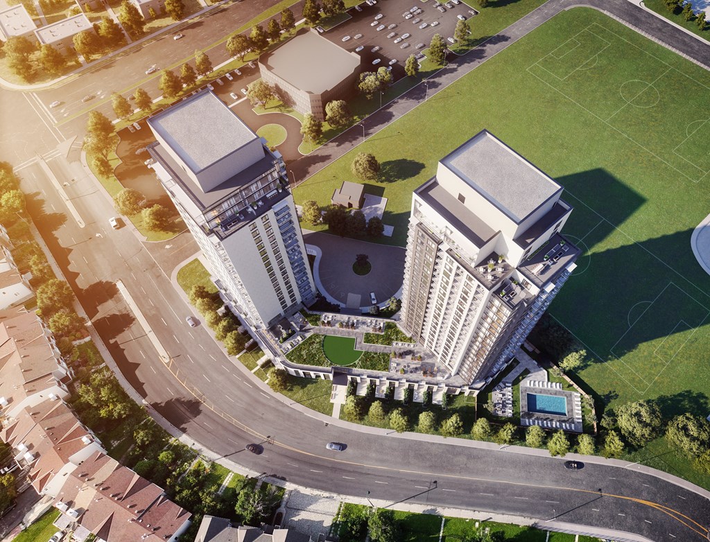 A large building with a pool in front of it.