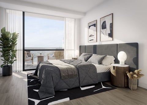 a bedroom with a large bed and a window