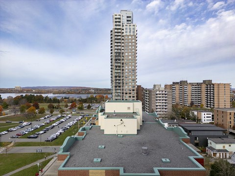 a tall building sitting on top of a roof in a city