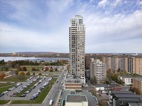 an aerial view of a tall building in a city