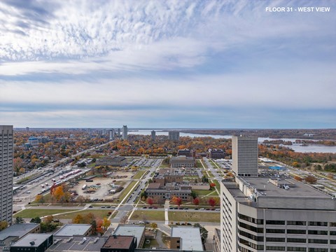 a view of the city from the top of a skyscraper