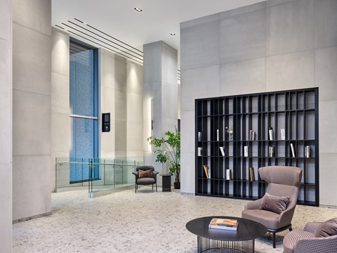 A modern lobby with bookshelf.