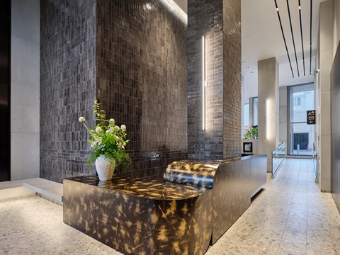 A reception area with a marble counter