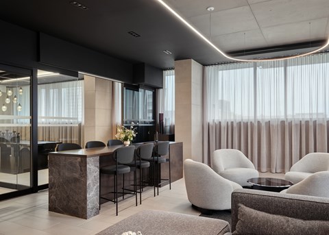 A modern living room with a bar area