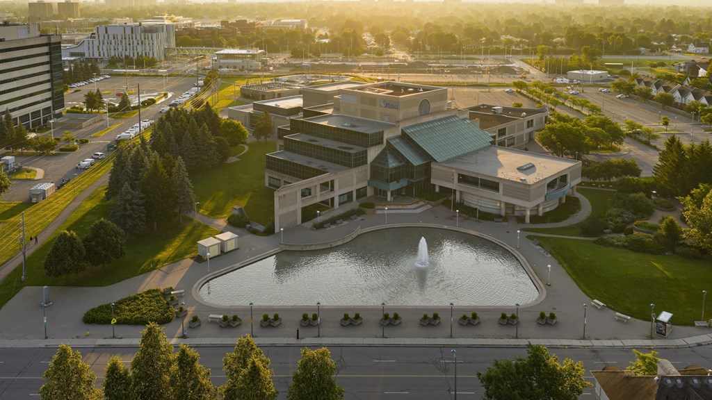 A large building with a fountain in front of it.