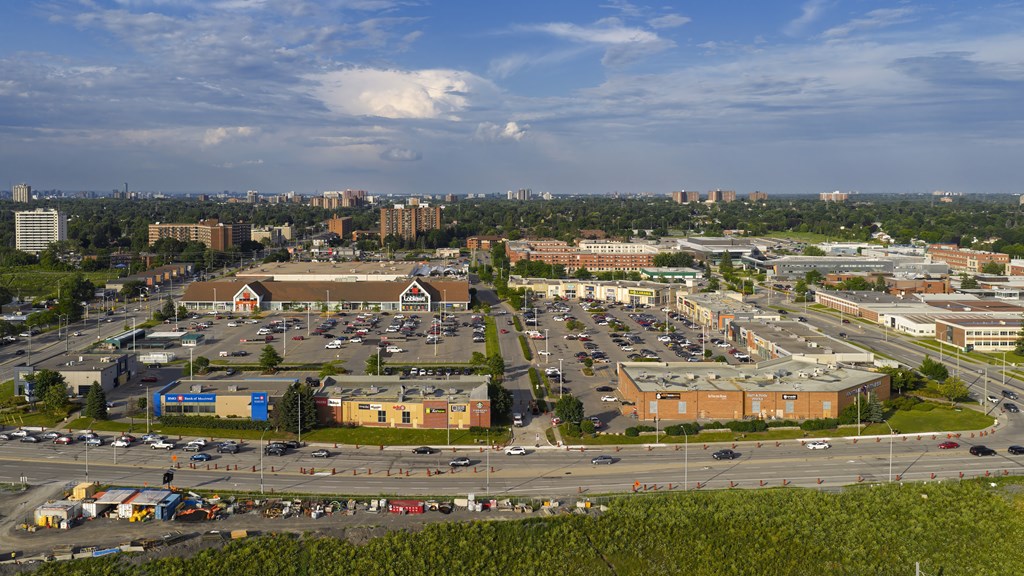 A view of a parking lot and buildings from a high vantage point.