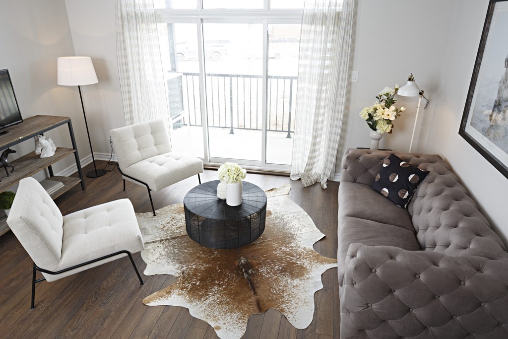 a living room with a couch and two chairs