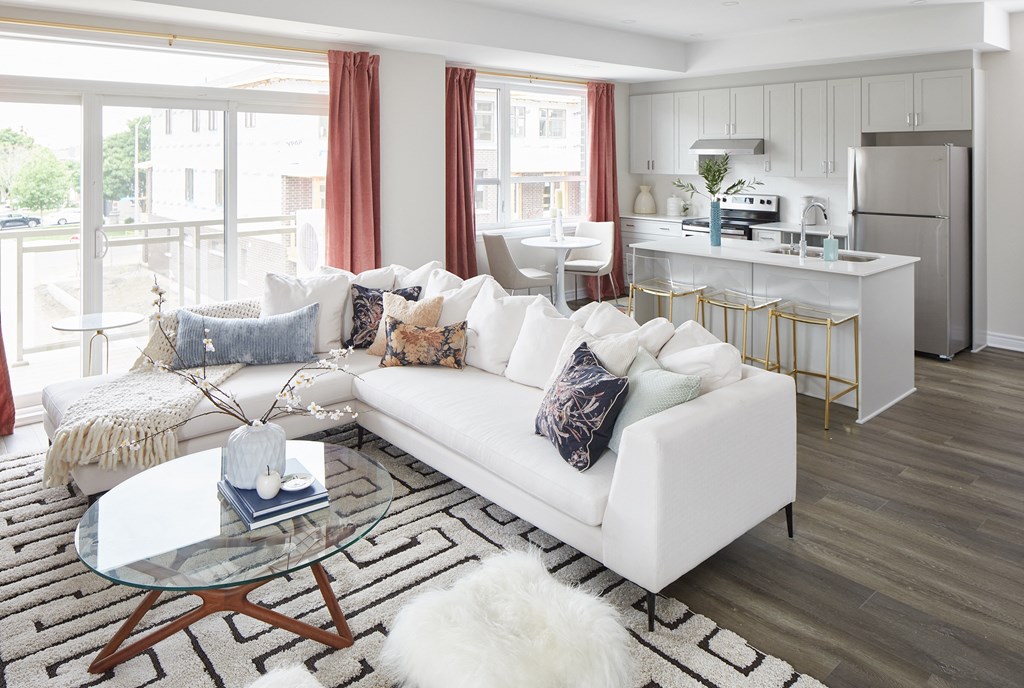a living room with a white couch and a table