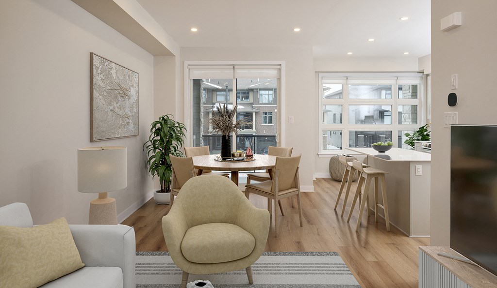 a living room and dining room with a table and chairs