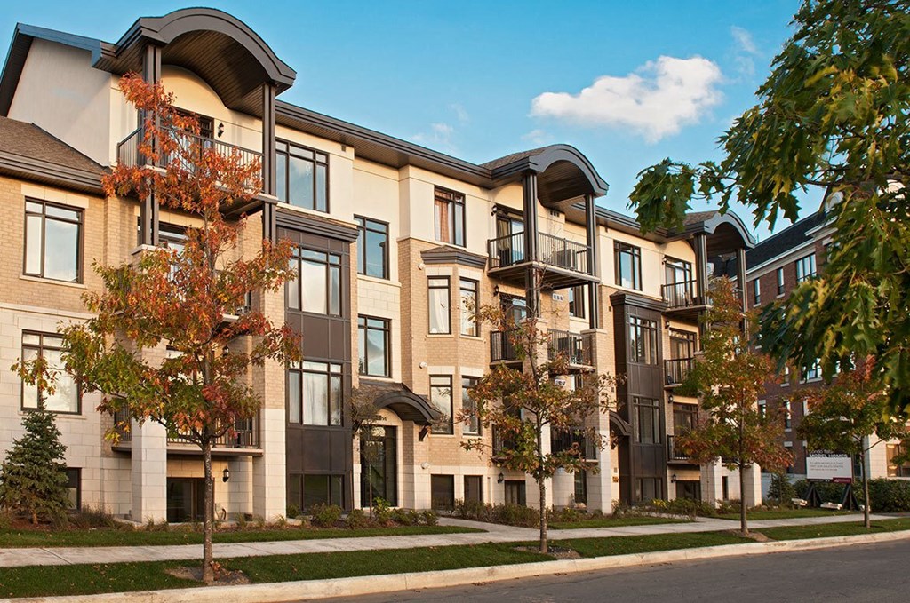 a rendering of a row of apartment buildings on a city street