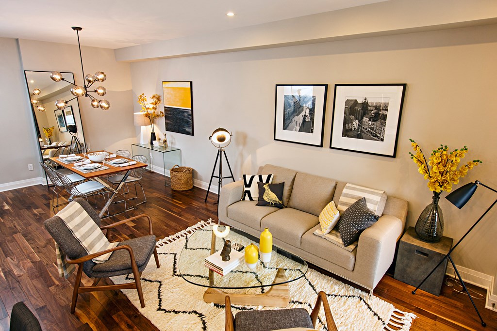 a living room and dining room with a couch and a table