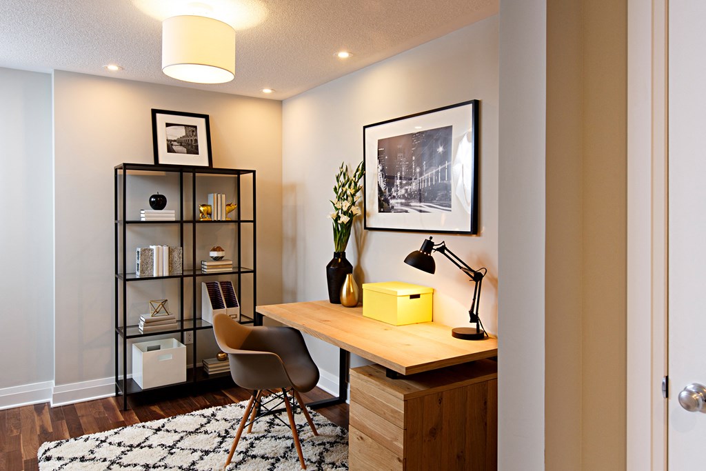 a home office with a wooden desk and a yellow box