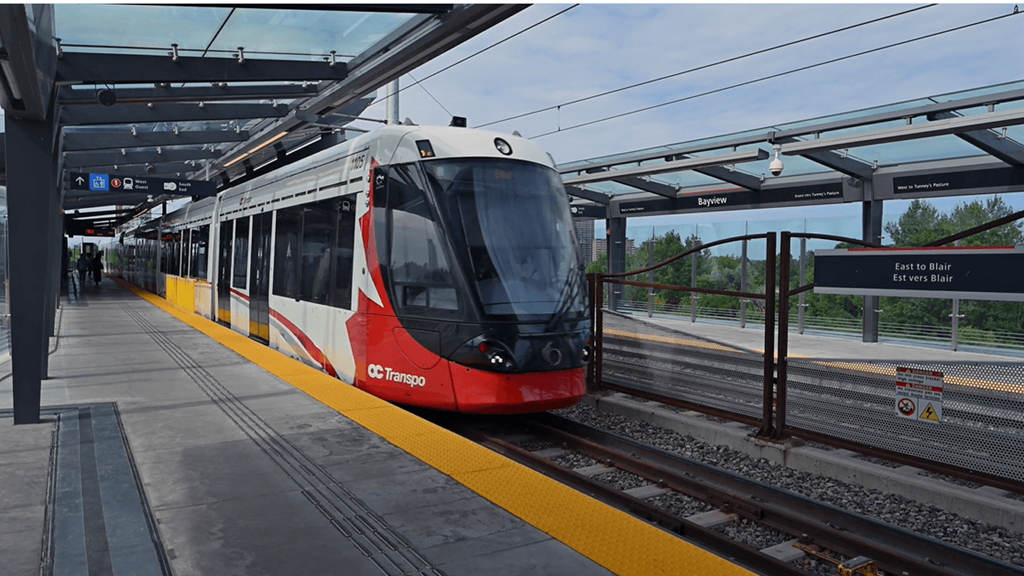 a red and white train at a train station