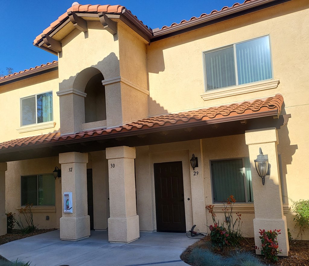 a house with a sidewalk in front of it