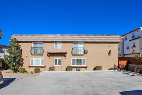 a building with a parking lot in front of it