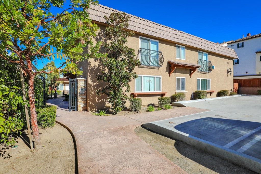a house with a driveway and a parking lot