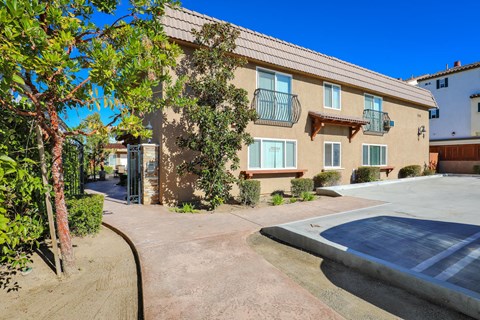 a house with a driveway and a parking lot