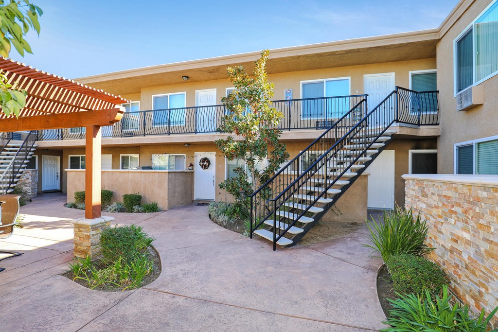 the entrance to an apartment building with a staircase