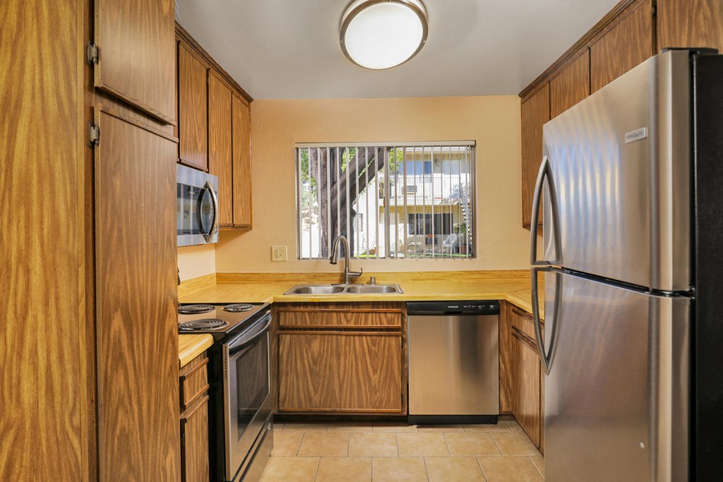 a kitchen with a sink and a refrigerator