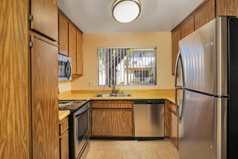 a kitchen with a sink and a refrigerator