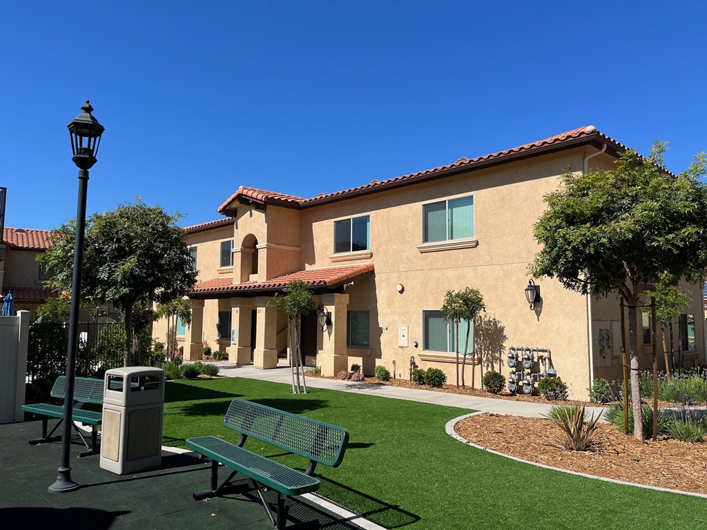 a park bench in front of a building