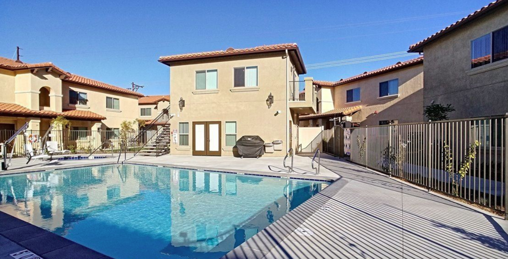 a swimming pool in the backyard of a house