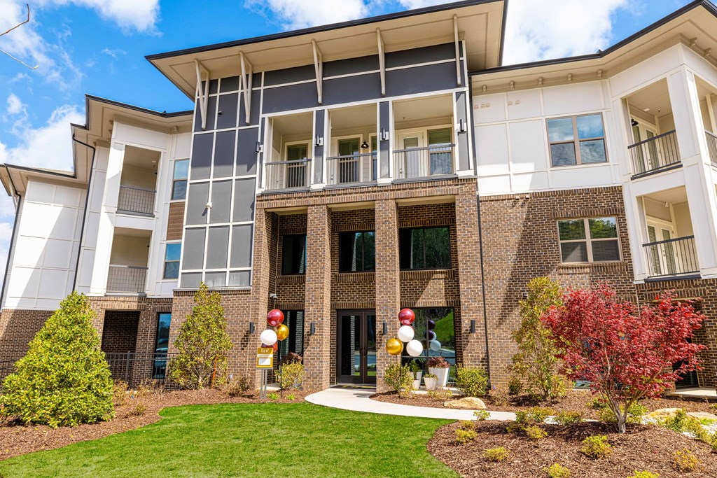 an apartment building with a courtyard and colorful decorations