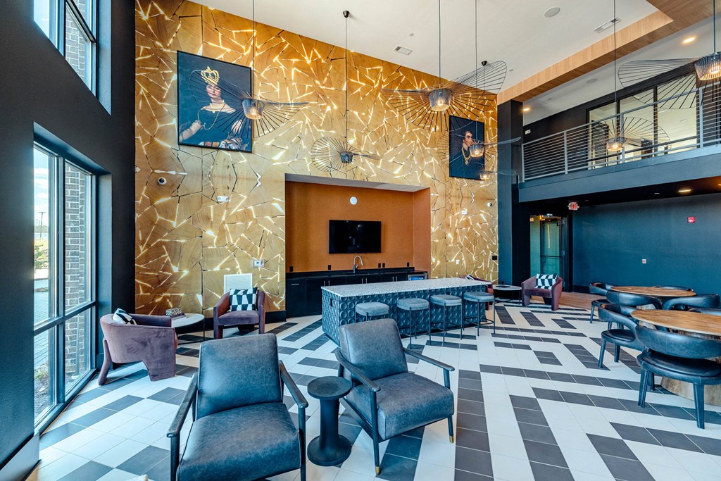 a lobby with a checkered floor and a bar with chairs and tables