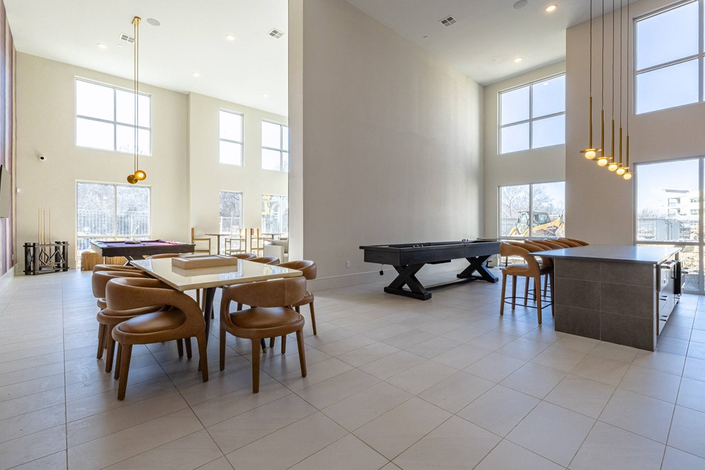 a game room with a pool table and a billiards table