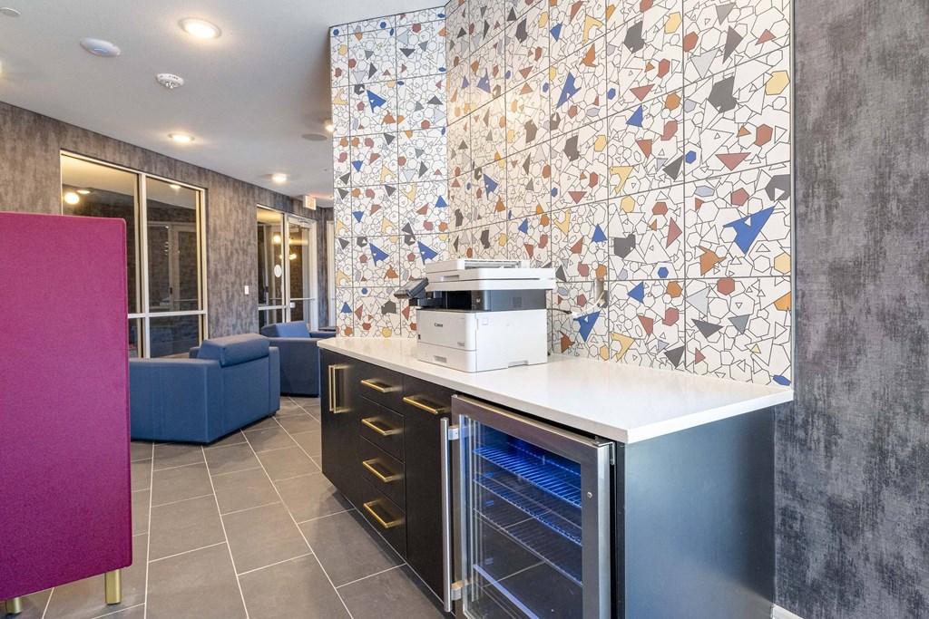 a kitchen with a counter top and a microwave on it