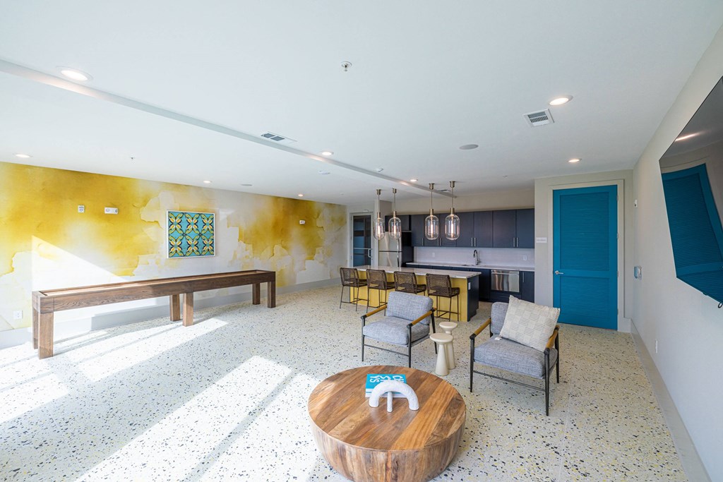 a living room with a dining room and a kitchen