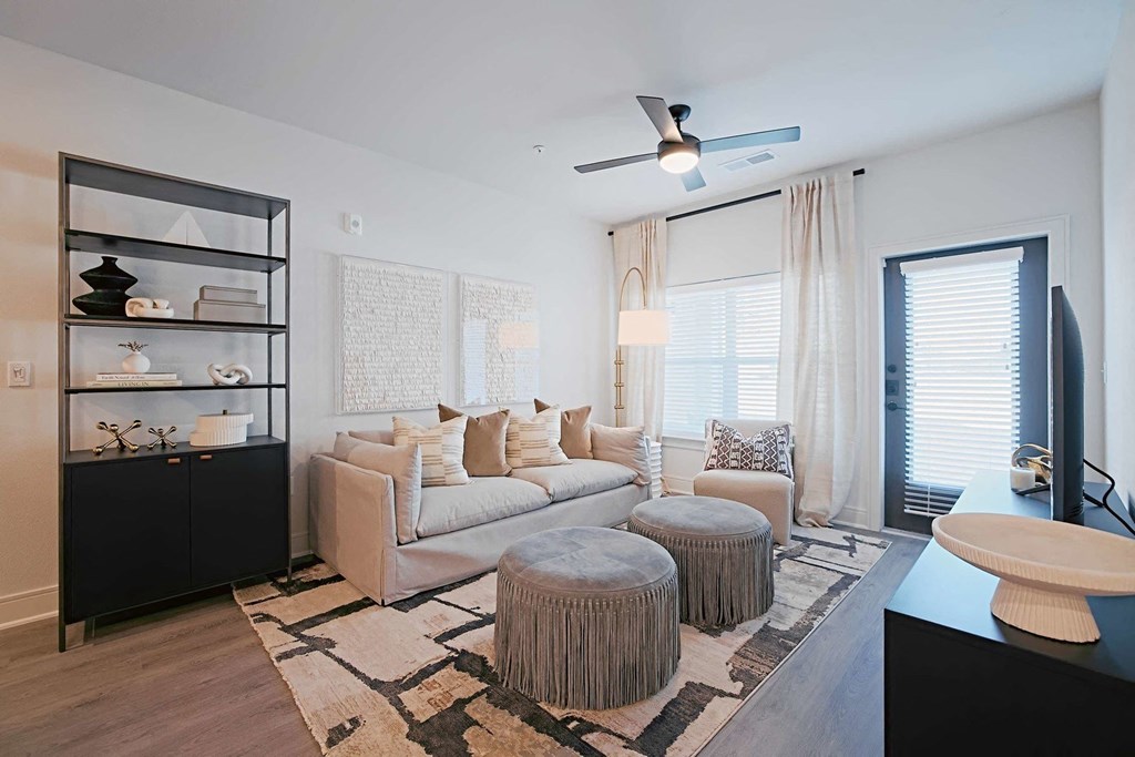 a living room with a couch and two tables