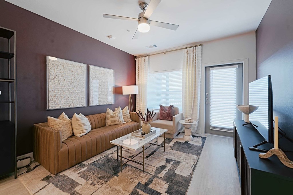 a living room with a couch and a tv