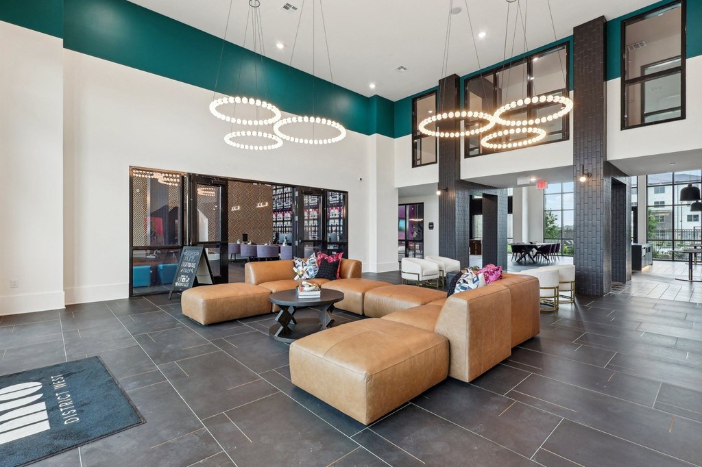 the lobby of a hotel with couches and chairs