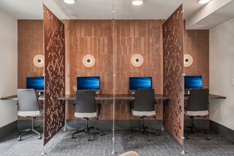 A room with brown walls and a screen on the wall.