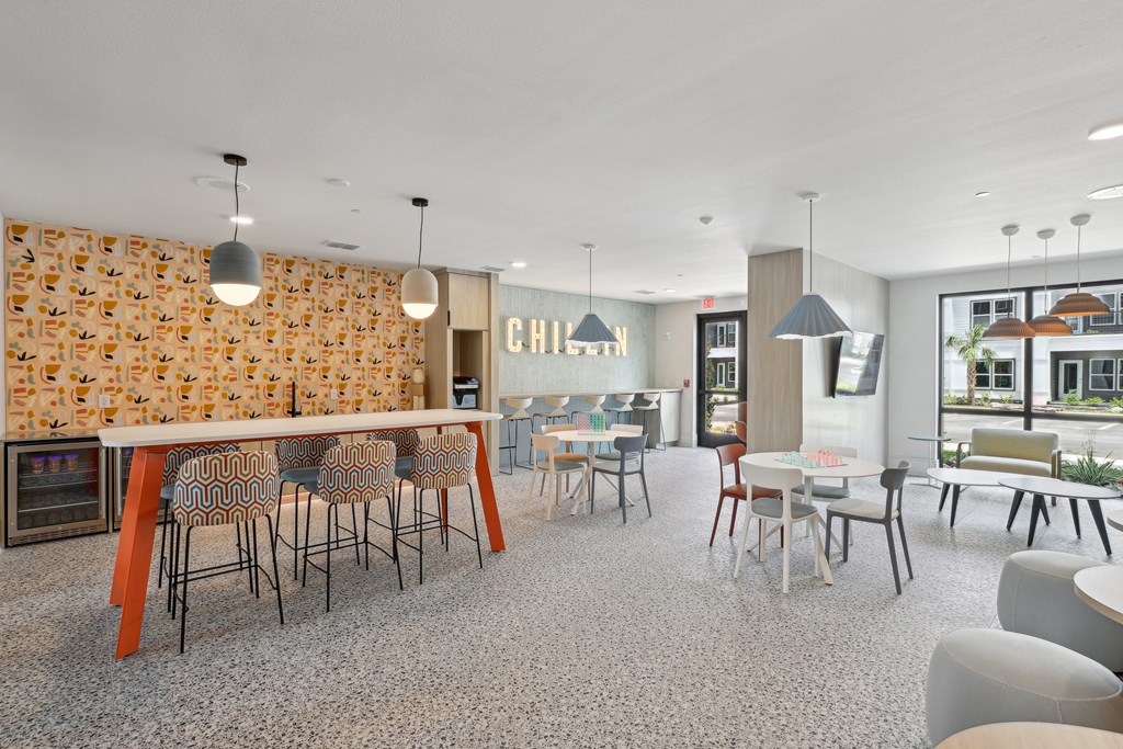 A modern dining room with a fireplace and a large table.